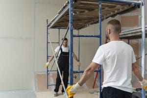 medium shot men working together Armaq
