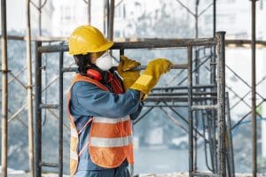 portrait man with safety equipment side view carrying ladder Armaq